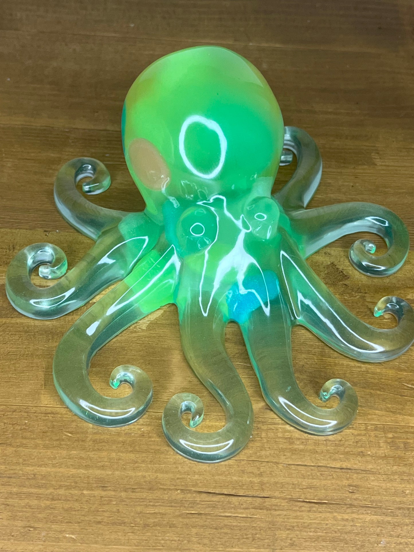 Resin octopus decoration on a wooden surface
