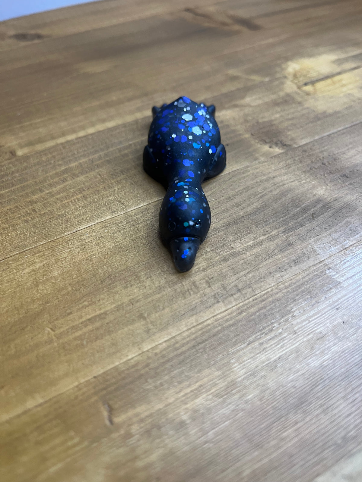 Resin Duck Figurine, Black with Blue Glitter Accent, Lying Collectible