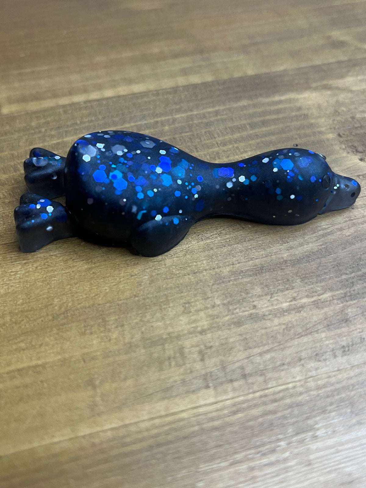 Resin Duck Figurine, Black with Blue Glitter Accent, Lying Collectible