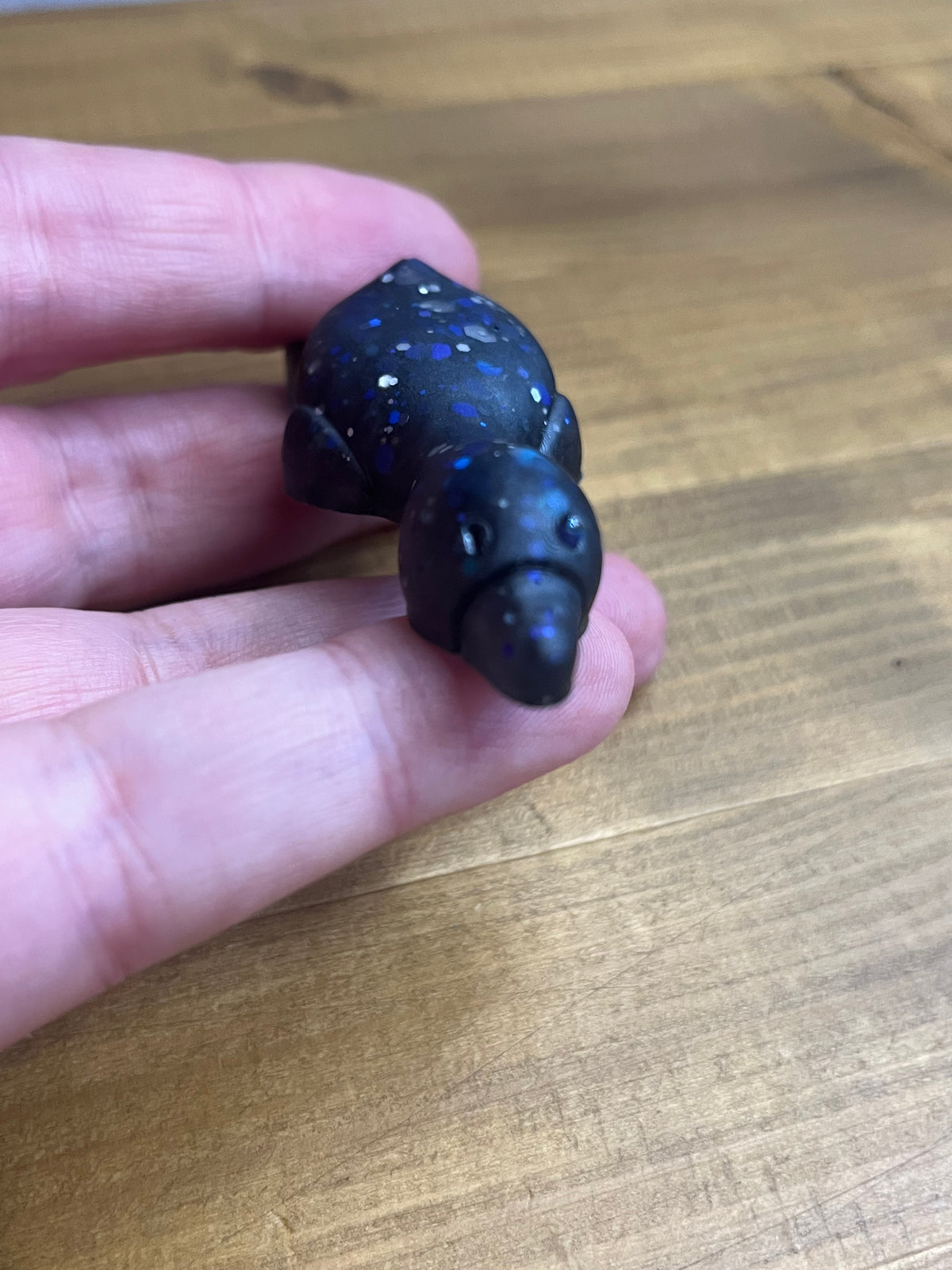 Resin Duck Figurine, Black with Blue Glitter Accent, Lying Collectible