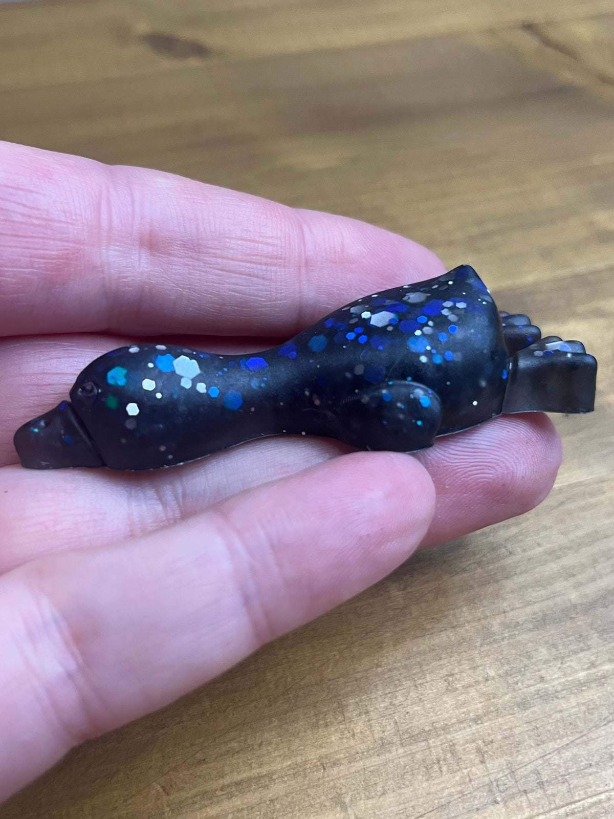 Resin Duck Figurine, Black with Blue Glitter Accent, Lying Collectible
